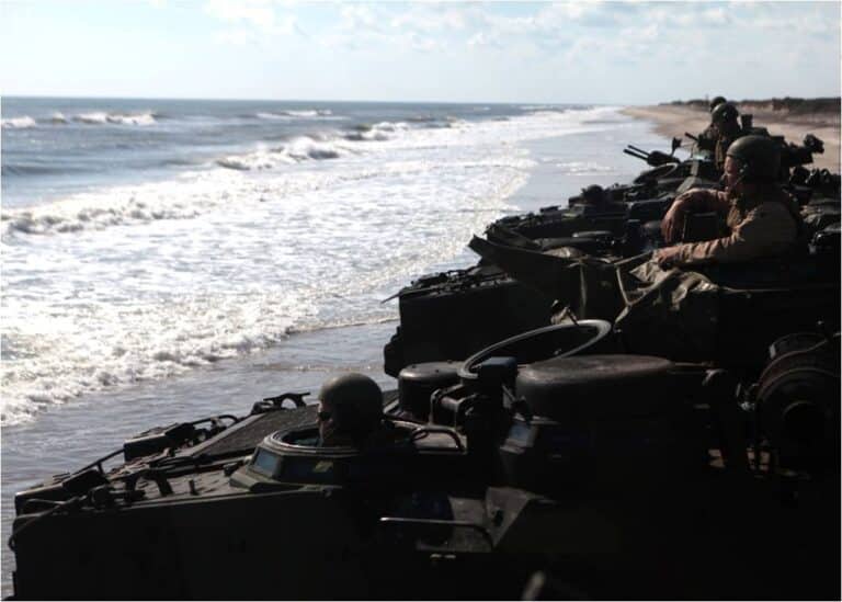 Marines with 2nd Amphibious Assault Battalion wait for...