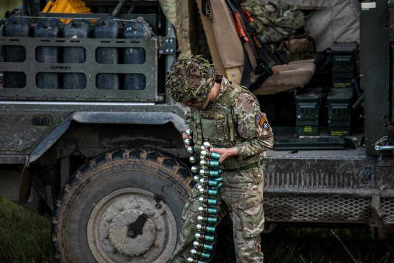 British Army Pte. Taylor from Poacher Troop prepares...