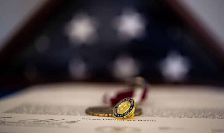 A U.S. Air Force retiree pin rests on a decoration...