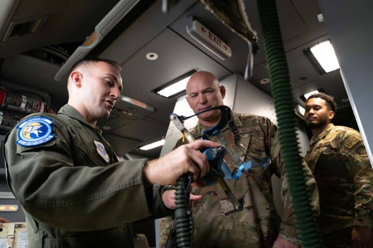 U.S. Air Force Tech. Sgt. Zachary Bieber, left, 6th Air...
