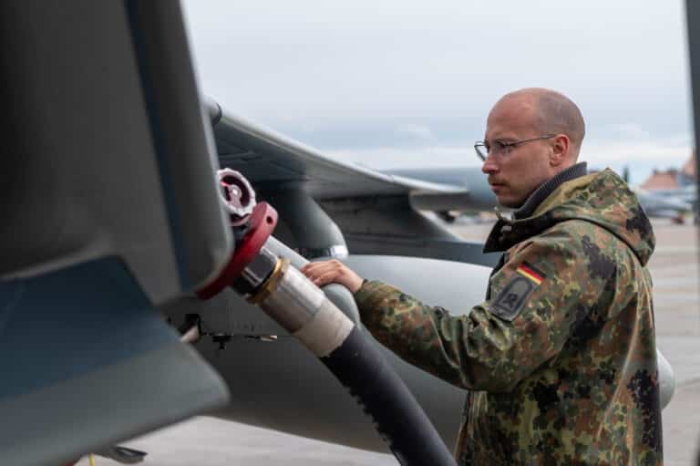 A German Air Force soldier refuels a German Air Force...