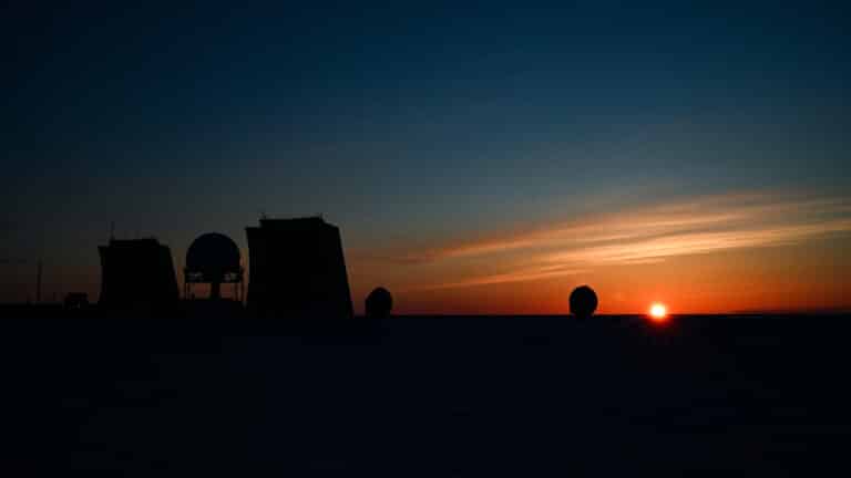 The morning sun rises over the North Warning System Site...