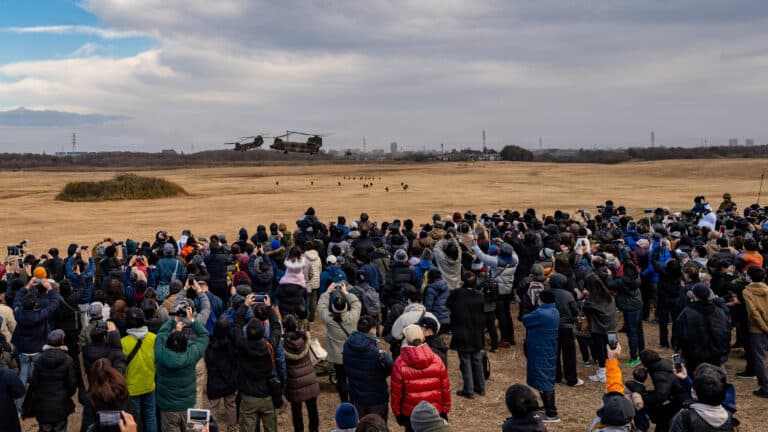 A crowd watches as Japan Ground Self-Defense Force...