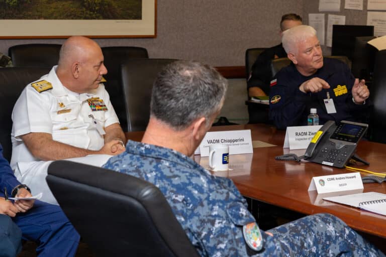 Vice Adm. Gian Marco Chiapperini, left, commander of the...