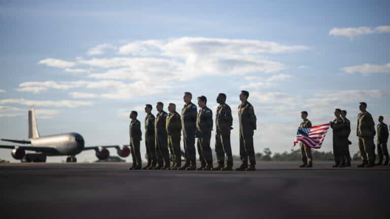 Multinational service members and leaders participate in...