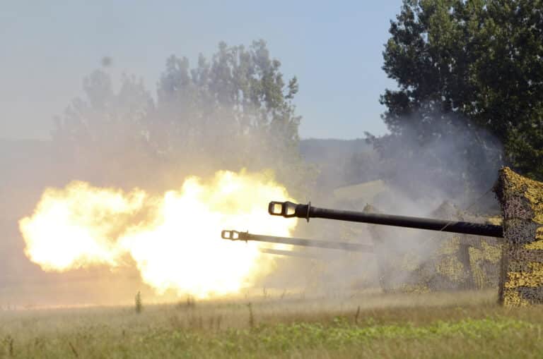 Soldiers from the Romanian Land Forces fire artillery...