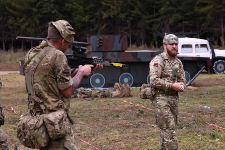 British Army Cpl. Bailey McAteer (right) with the 3rd...