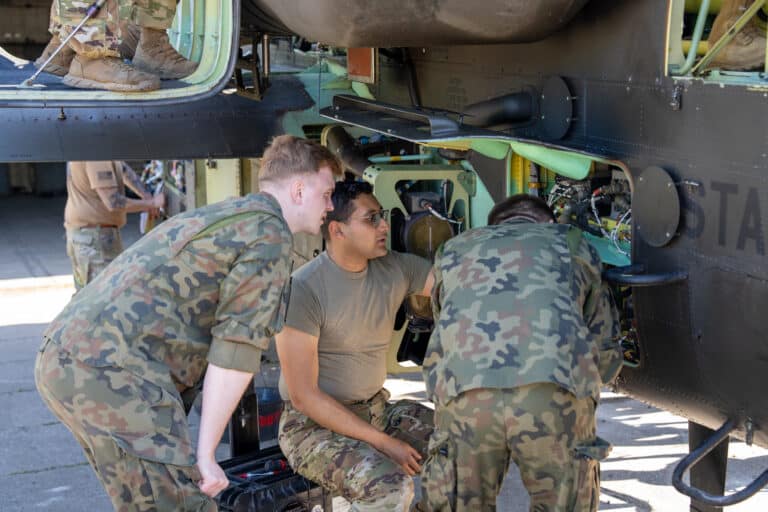 U.S. Army Spc. Mathew Ramirez, center, an Apache...