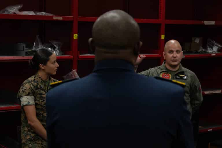U.S. Marine Corps Gunnery Sgt. Tyler Webb, right, the...
