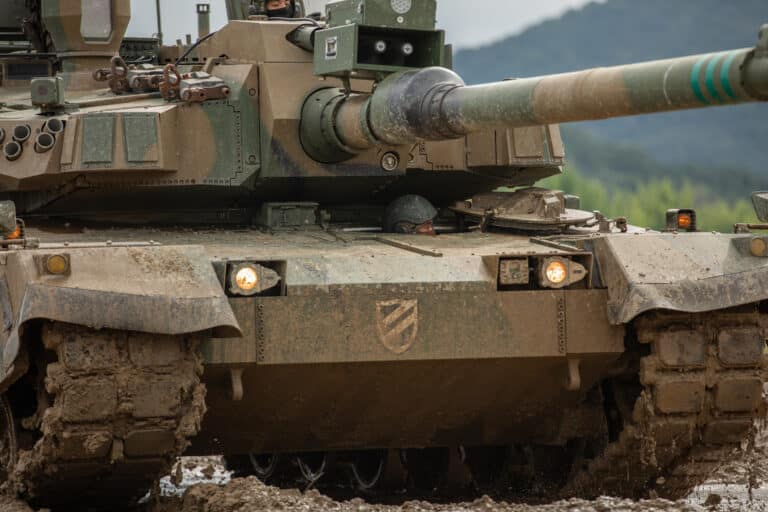 A ROK army tank crewman peers out of the driver's hatch...