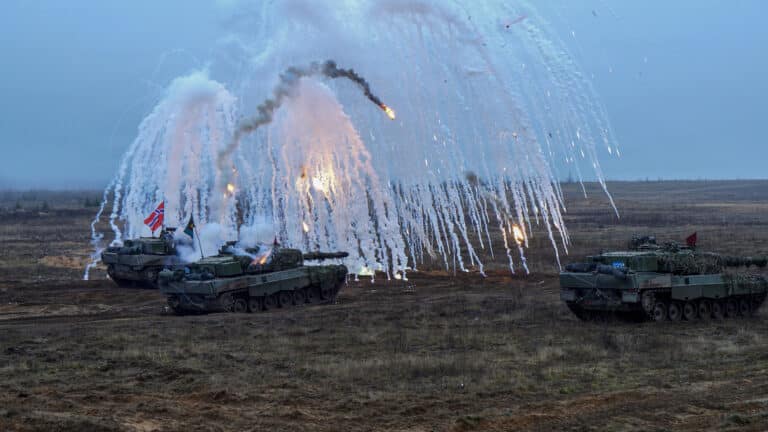 Norwegian Leopard 2A8 battle tanks release smoke,...
