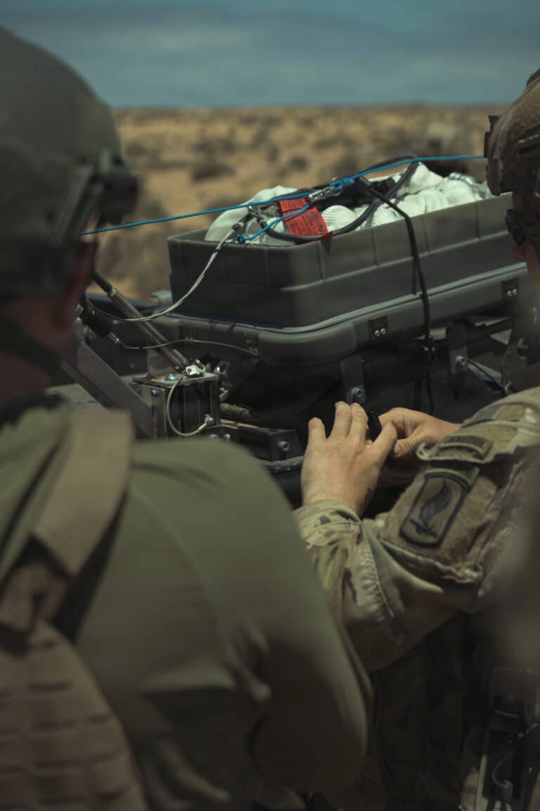 Contractors assist U.S. Soldiers assigned to the Combat...