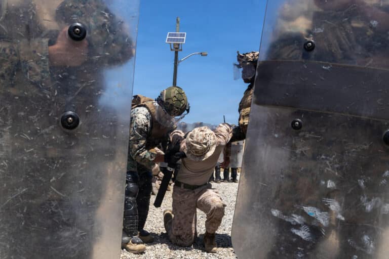 U.S. Marine Corps Cpl. Aiden Katz, a non-lethal weapons...