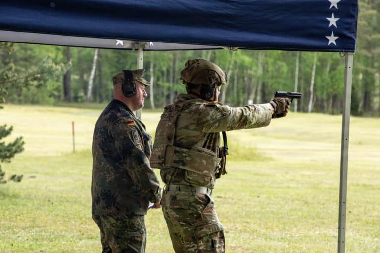 A U.S. Army Soldier fires the German P8 pistol during...