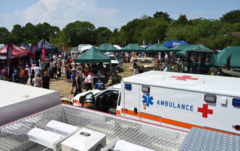 An American fire truck, ambulance, and other military...