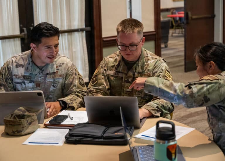 U.S. Airmen discuss a product during an artificial...