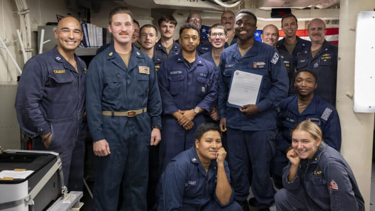 Sailors pose for a group picture photo after a frocking...