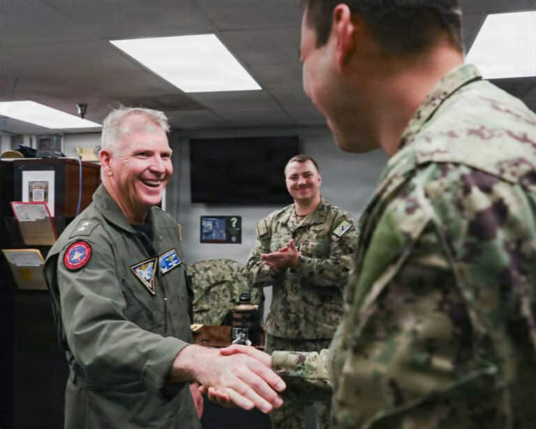 Rear Adm. Rich Brophy, left, commander, Naval Air Force...